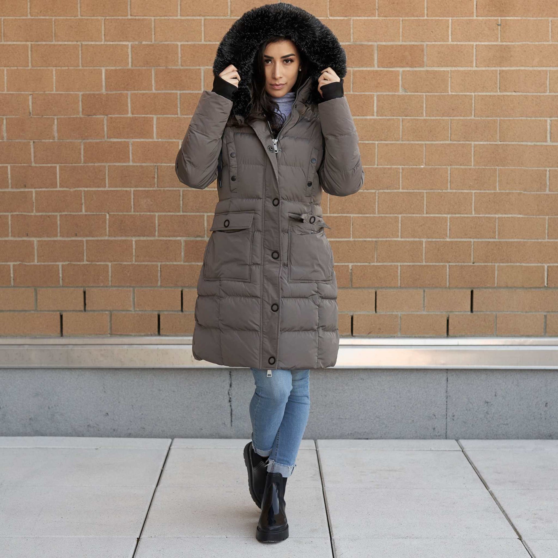 Women's winter coat with faux fur hood and cargo pockets, vegan down, water-resistant.